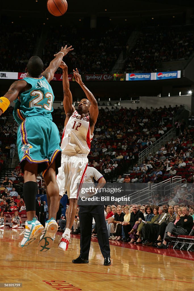 Hornets Rockets 2002 Rafer Alston of the Houston Rockets shoots over J.R. Smith of the New ...