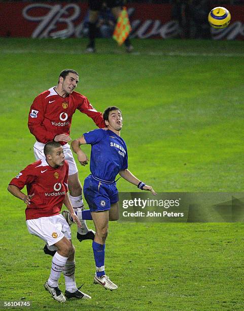 Alan Smith and John O'Shea of Manchester United clash with Joe Cole of Chelsea during the Barclays Premiership match between Manchester United and...