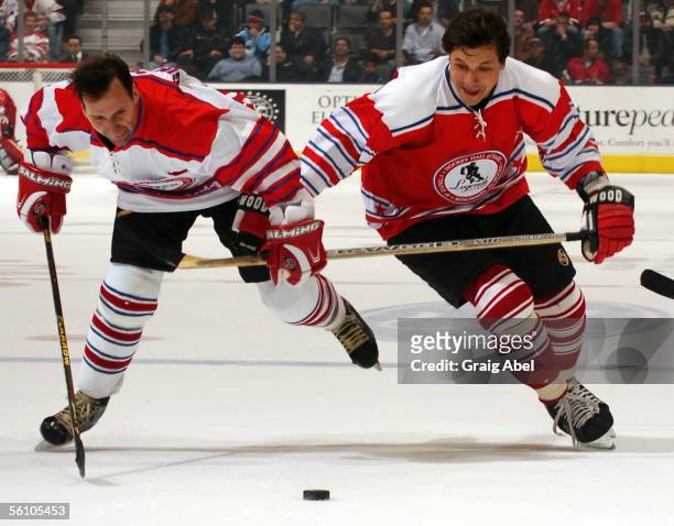 Gaston Gingras and Valeri Kamensky battle for the puck during the Hockey Hall of Fame's Legends of Hockey Game on November 6, 2005 at the Air Canada...