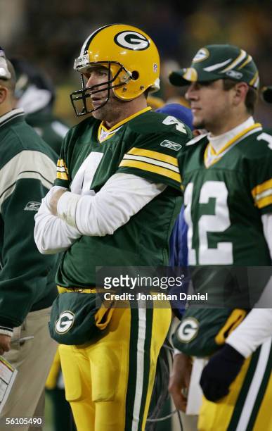 Quarterbacks Brett Favre and Aaron Rodgers of the Green Bay Packers watch the final minutes of a game against the Pittsburgh Steelers from the...