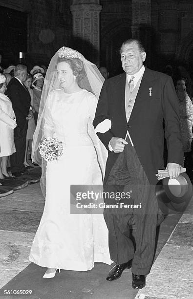 Pilar, sister of King Juan Carlos de Borbon, the day of her wedding to Luis Gomez Acebo, was escorted to the altar by her father, Don Juan de Borbon...