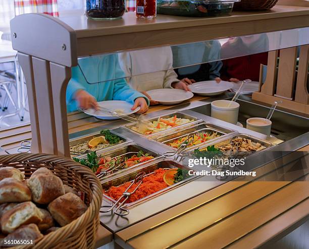 school lunch with salad buffet - cafeteria stockfoto's en -beelden