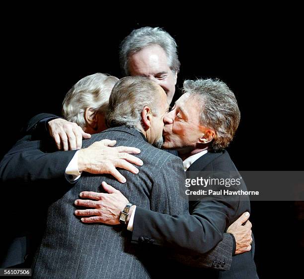 Actor Joe Pesci joins Tommy DeVito, Bob Gaudio and Frankie Valli of Frankie Valli and the Four Seasons onstage during the curtain call at the play...