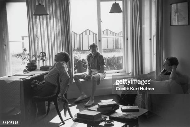 English composer Benjamin Britten at home in Aldeburgh, Suffolk, 15th October 1949, where he is working on his new opera 'Billy Budd with novelist...