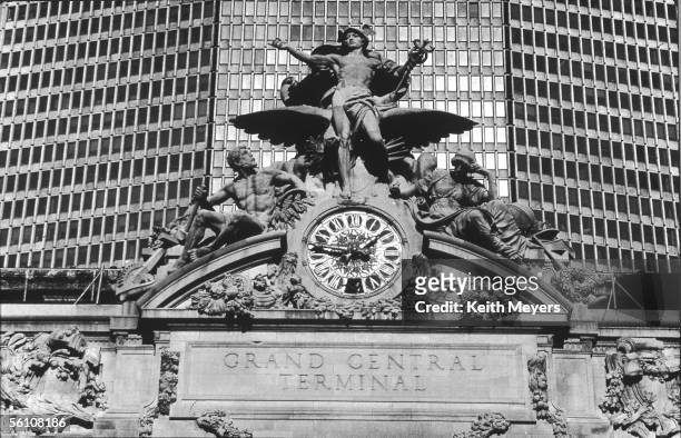 The clock and group sculpture on the exterior of Grand Central Terminal in New York, 30th January 1988. The sculpture, designed by Jules Couton,...