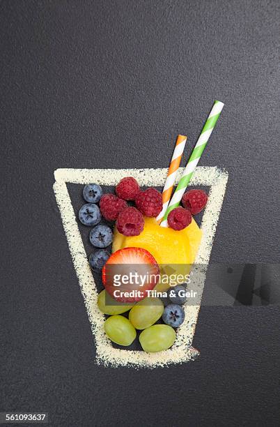 blackboard illustration of drinking glass with fruit and drinking straws - juice drink stock illustrations