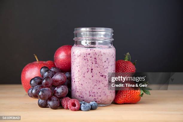 still life of fresh grape, apple and berry smoothie - grape smoothie ストックフォトと画像