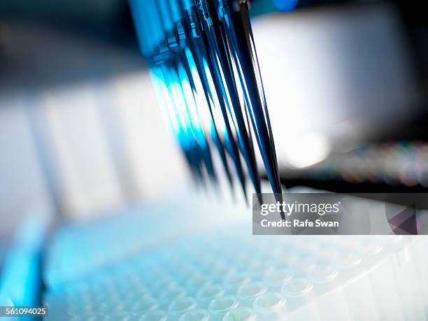 automated chemical sampler in action used to test chemical and dna samples - precision medicine stock pictures, royalty-free photos & images