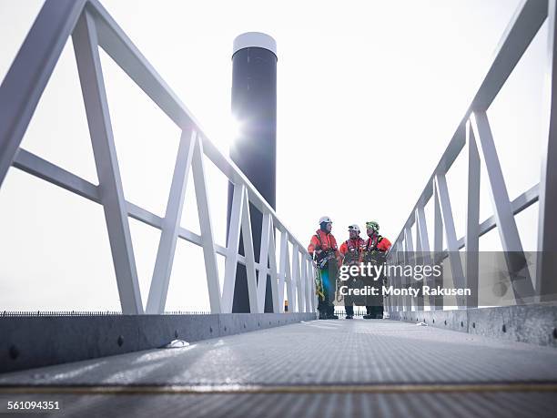 offshore windfarm engineers in port on walkway - offshore wind farm stock pictures, royalty-free photos & images