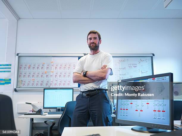 portrait of offshore windfarm engineer in office - monty rakusen portrait stock pictures, royalty-free photos & images