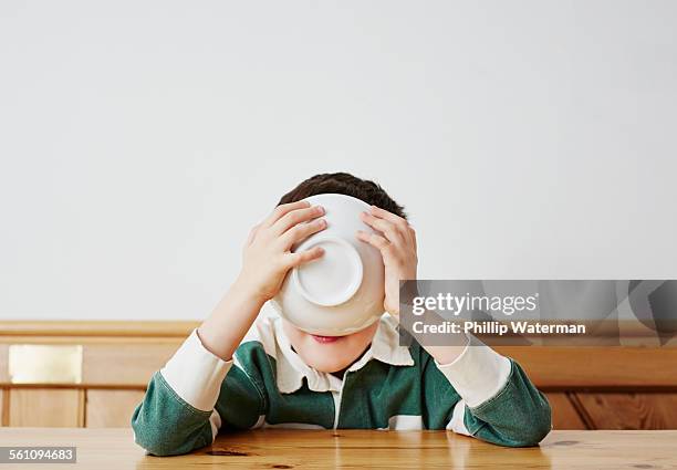 boy drinking milk from bowl - bowl of cereal ストックフォトと画像