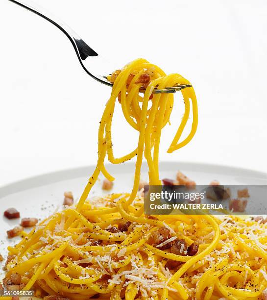 forkful of spaghetti alla carbonara - pancetta stock pictures, royalty-free photos & images