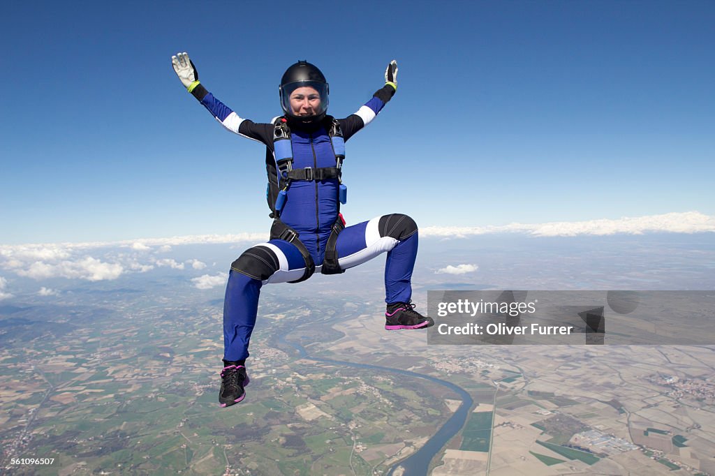 Freeflying skydiver in blue sky