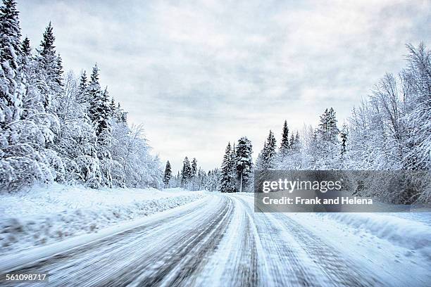 view of snow covered forest highway, hemavan, sweden - hemavan stock pictures, royalty-free photos & images