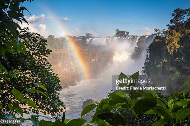 iguazú waterfalls with rainbow, argentina - iguazú stock pictures, royalty-free photos & images