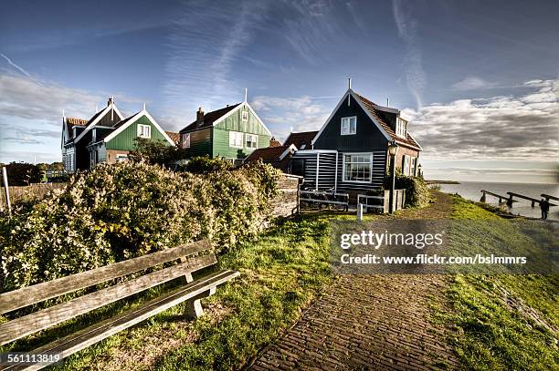 house at the dike - ijsselmeer stock pictures, royalty-free photos & images