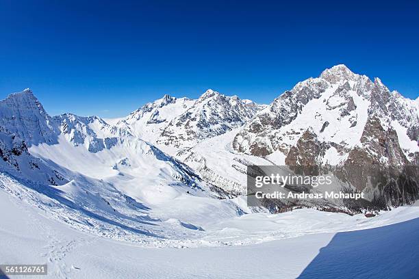 panoramic view of mont blanc in winter - courmayeur stock-fotos und bilder