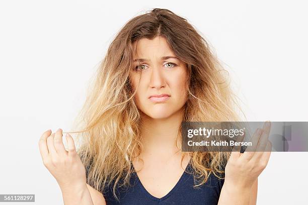 young woman with damaged dyed hair - frizzy stock pictures, royalty-free photos & images