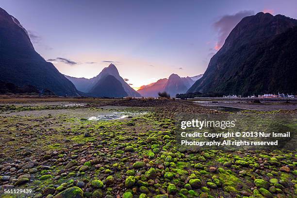 sunset in milford sound - mitre peak stock pictures, royalty-free photos & images