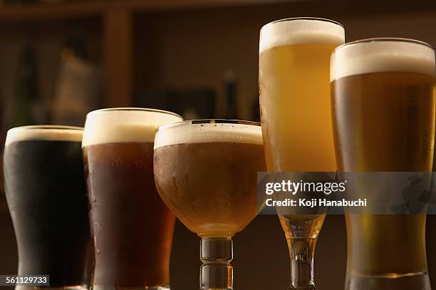 selection of beers in glasses - lagerbier stock-fotos und bilder