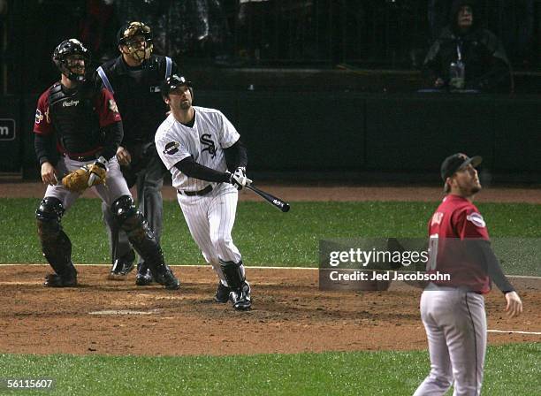 Paul Konerko of the Chicago White Sox hits a grand-slam home run against pitcher Chad Qualls of the Houston Astros in the seventh inning during Game...