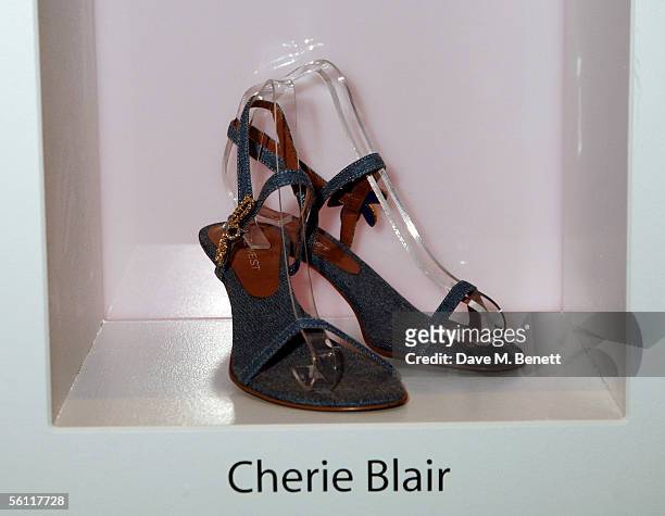 Shoes donated by Cherie Blair are displayed at the aftershow party following the UK premiere of "In Her Shoes," at the Grosvenor House Hotel on...