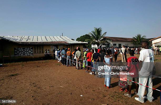 Liberians line up at a polling site to cast their votes in the presidential election on November 8, 2005 in Monrovia, Liberia. Voters were summoned...