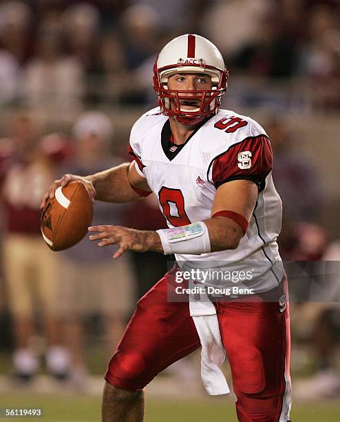 Quarterback Marcus Stone of the North Carolina State Wolfpack scrambles against the Florida State Seminoles at Doak Campbell Stadium on November 5,...