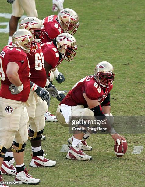 Center David Castillo of the Florida State Seminoles prepares to snap the ball against the North Carolina State Wolfpack at Doak Campbell Stadium on...