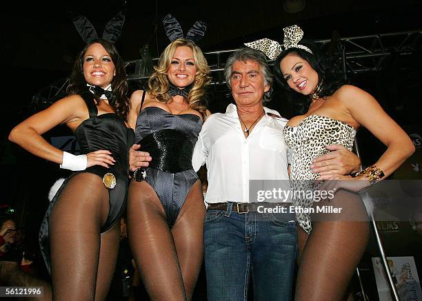 Designer Roberto Cavalli poses with Playboy Playmates Cara Zavaleta, Stacy Sanches and Playboy Playmate of the Year 2005 Tiffany Fallon, all modeling...