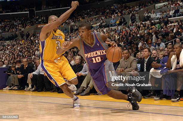 Leandro Barbosa of the Phoenix Suns drives to the basket past Devean George of the Los Angeles Lakers during the game at Staples Center on November...