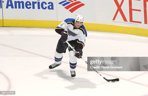 Defenseman Eric Brewer of the St. Louis Blues passes the puck against the Los Angeles Kings at Staples Center on October 29, 2005 in Los Angeles,...