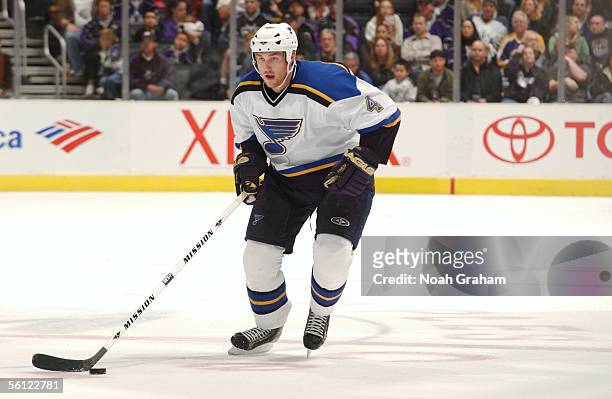 Defenseman Eric Brewer of the St. Louis Blues skates with the puck against the Los Angeles Kings at Staples Center on October 29, 2005 in Los...