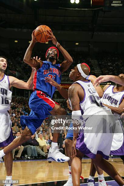 Richard Hamilton of the Detroit Pistons drives to the basket for a layup against Bonzi Wells of the Sacramento Kings on November 8, 2005 at the ARCO...