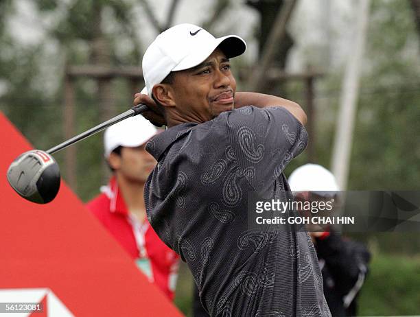 World number one Tiger Woods tees off during a practice round at the five-million-dollar HSBC Champions tournament in Shanghai 09 November 2005. The...