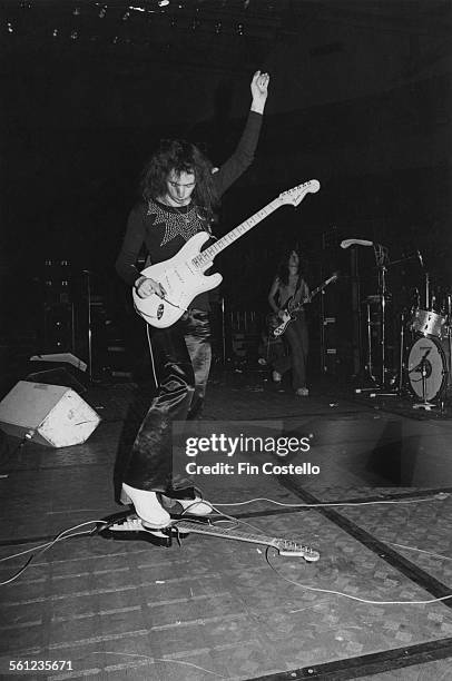 Guitarist and songwriter Ritchie Blackmore playing two guitars, one with his foot, on stage with British rock group Deep Purple, at Boston Garden,...