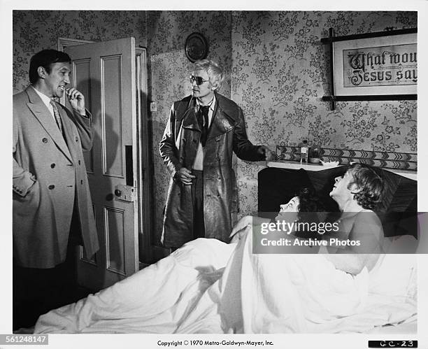 George Sewell , Tony Beckley , Rosemarie Dunham and Michael Caine in a publicity still for Mike Hodges' thriller, 'Get Carter', 1970.