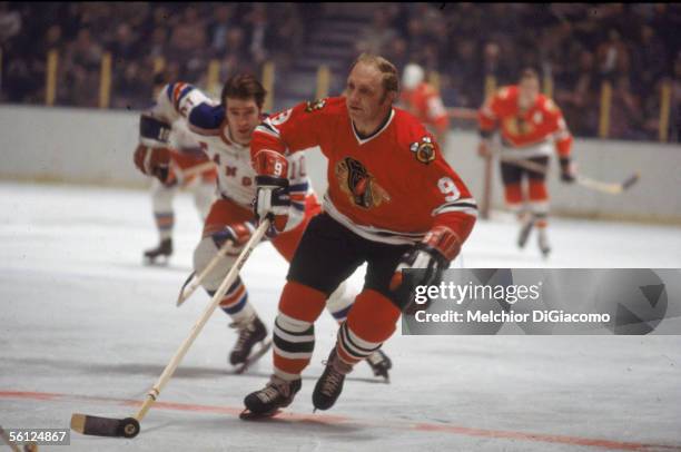 Canadian professional hockey player Bobby Hull of the Chicago Blackhawks skates on the ice during a road game against the New York Rangers as Ranger...