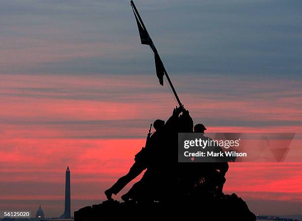 An early morning sun begins to rise over the Iwo Jima Memorial November 9, 2005 in Arlington, Virginia. On November 19, the U.S. Marines will...