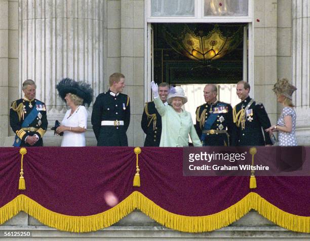 Queen Elizabeth II waves to the crowds from a Buckingham Palace balcony during celebrations to mark the 60th anniversary of the end of World War II,...