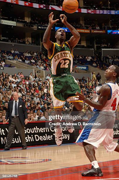 Ronald Murray of the Seattle SuperSonics loses control of the ball under pressure from Anthony Goldwire of the Los Angeles Clippers during the...