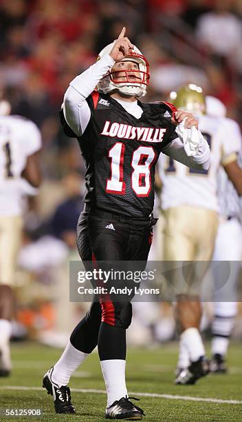Kicker Arthur Carmody of the Louisville Cardinals points to the sky during the game against the Pittsburgh Panthers at Papa John's Stadium on...