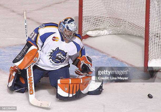 Goaltender Wade Dubielewicz of the Bridgeport Sound Tigers makes a save against the Manchester Monarchs at the Arena at Harbor Yard on November 4,...