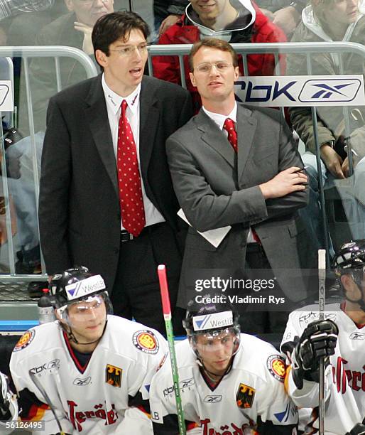 Head Coach Greg Poss of Germany discuss with his Assistant Uwe Krupp during the TUI Nations Cup match between Germany and USA at the SAP Arena on...