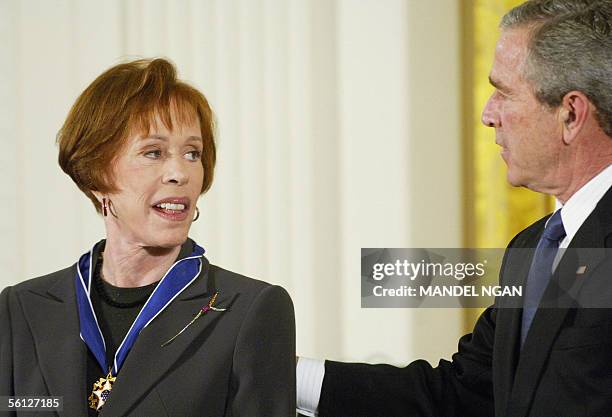 Washington, UNITED STATES: US President George W. Bush presents the Presidential Medal of Freedom, the nation's highest civil award, to actress Carol...