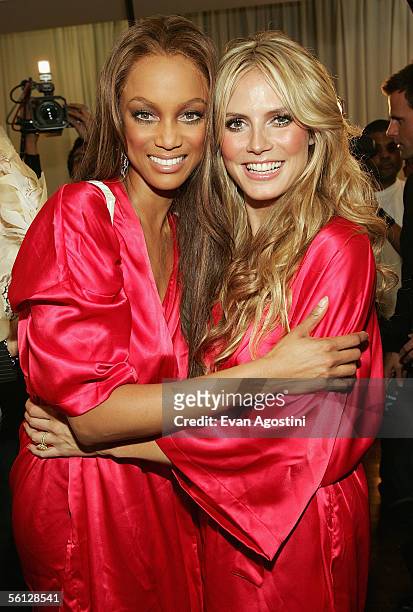 Models Tyra Banks and Heidi Klum pose backstage for The Victoria's Secret Fashion Show at the 69th Regiment Armory November 9, 2005 in New York City.
