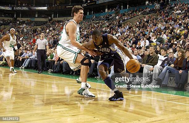 Eddie Jones of the Memphis Grizzles drives past Raef LaFrentz of the Boston Celtics on November 9, 2005 at the TD Banknorth Garden in Boston,...