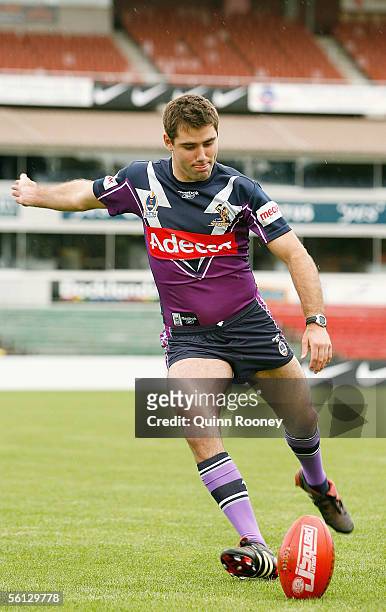 Cameron Smith of the Melbourne Storm tests his skills kicking a football after the media announcement that Melbourne Storm will share Optus Oval with...