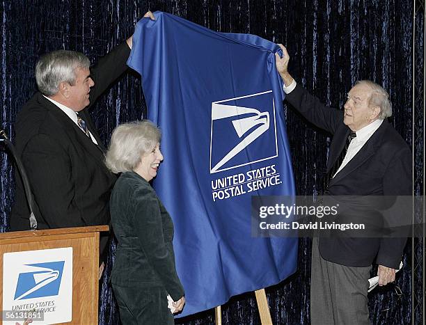 John E. Potter, Postmaster General and CEO of the U.S. Postal Service, Mona Malden and actor Karl Malden unveil the dedication sign during the...