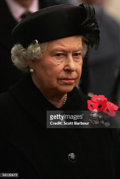 Britain's Queen Elizabeth II stands for a two-minute silence in the Field of Remembrance at Westminster Abbey on November 10, 2005 in London,...
